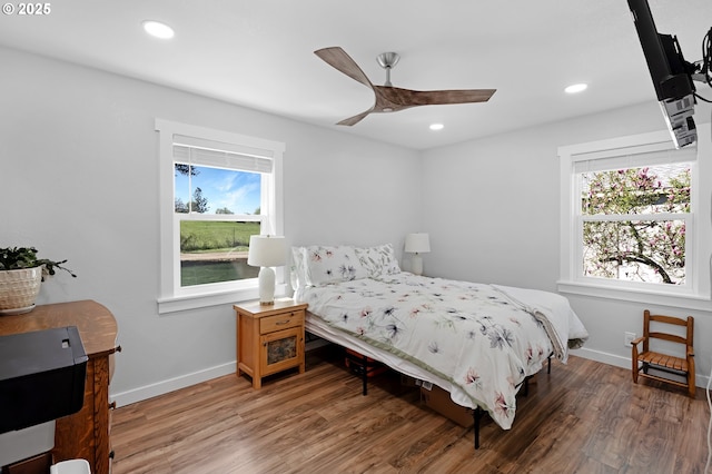 1069 Little Valley Rd, Roseburg, OR 97471 - bedroom with multiple windows, wood finished floors, recessed lighting, and a ceiling fan