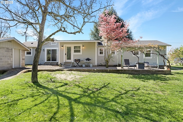 1069 Little Valley Rd, Roseburg, OR 97471 - rear view of house with entry steps, a patio, and a lawn