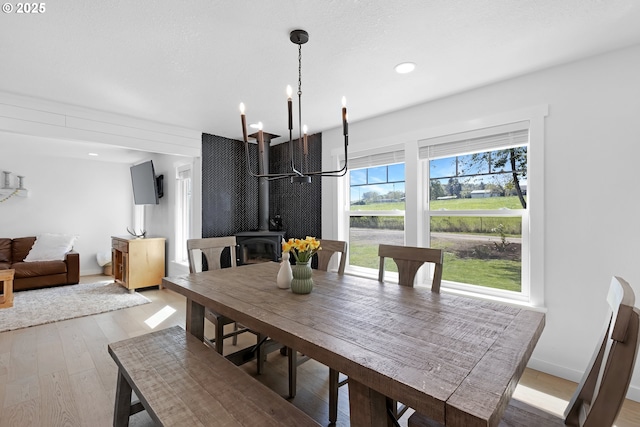 1069 Little Valley Rd, Roseburg, OR 97471 - dining room with a wood stove, light wood-style flooring, and recessed lighting