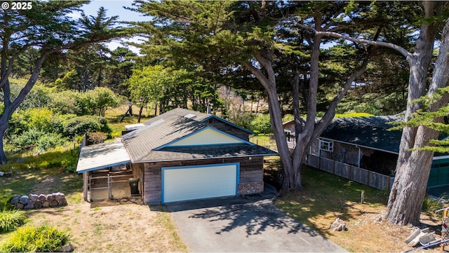 1260 Jackson Ave, Bandon, OR 97411 - view of front of property featuring driveway, a garage, and a shingled roof