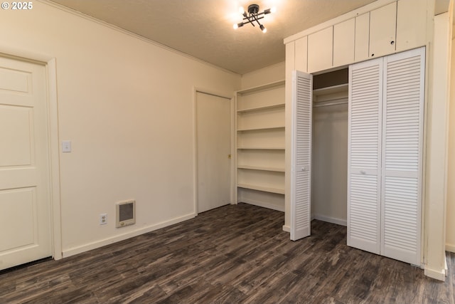 1260 Jackson Ave, Bandon, OR 97411 - unfurnished bedroom featuring dark wood-type flooring and ornamental molding