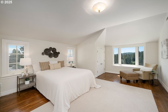 2892 NW Beuhla Vista Ter, Portland, OR 97210 - bedroom featuring vaulted ceiling, dark wood finished floors, and baseboards
