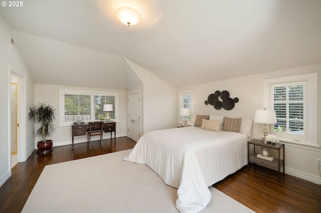 2892 NW Beuhla Vista Ter, Portland, OR 97210 - bedroom featuring wood finished floors, multiple windows, baseboards, and lofted ceiling