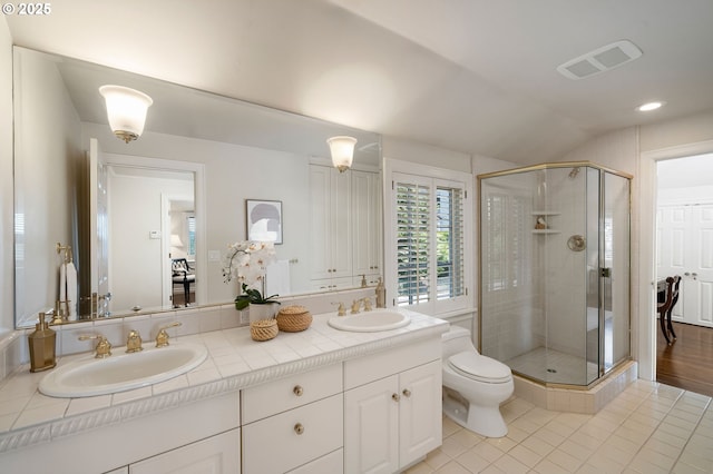 2892 NW Beuhla Vista Ter, Portland, OR 97210 - full bathroom featuring tile patterned flooring, a stall shower, double vanity, toilet, and vaulted ceiling