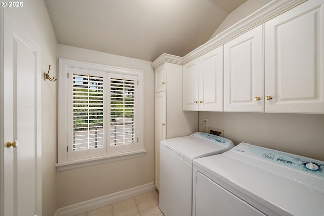 2892 NW Beuhla Vista Ter, Portland, OR 97210 - laundry room with cabinet space, separate washer and dryer, baseboards, and light tile patterned floors