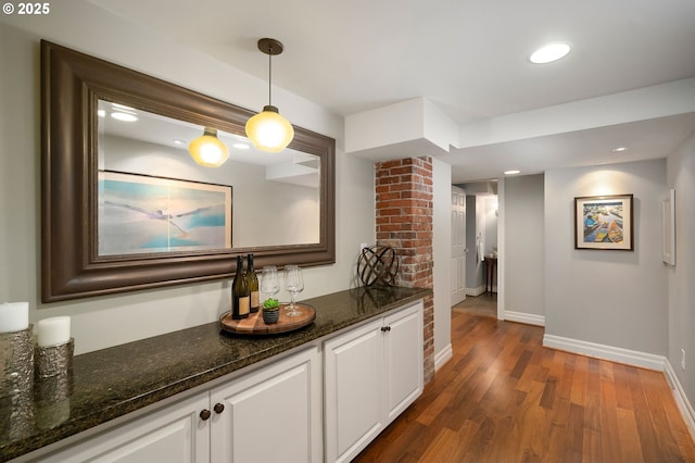 2892 NW Beuhla Vista Ter, Portland, OR 97210 - bar featuring baseboards, wood finished floors, decorative light fixtures, and recessed lighting