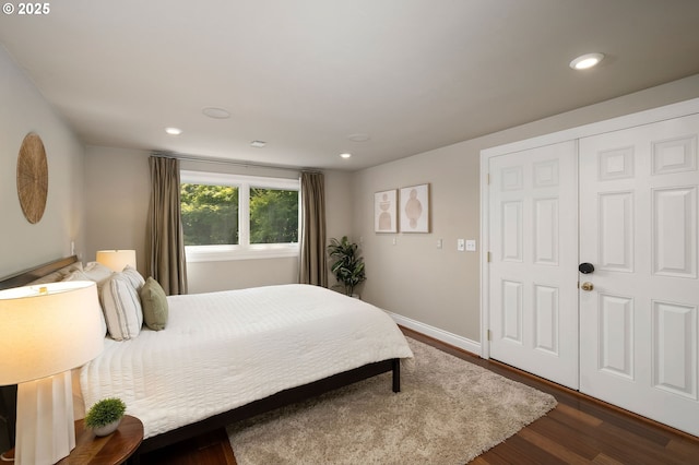 2892 NW Beuhla Vista Ter, Portland, OR 97210 - bedroom featuring dark wood-style floors, recessed lighting, baseboards, and a closet