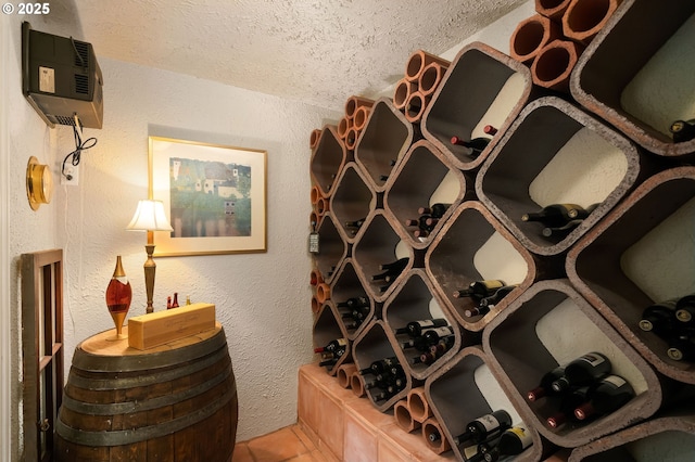 2892 NW Beuhla Vista Ter, Portland, OR 97210 - wine room with a textured ceiling, a textured wall, and tile patterned floors