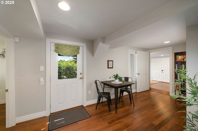 2892 NW Beuhla Vista Ter, Portland, OR 97210 - entryway featuring dark wood-style flooring, baseboards, and recessed lighting