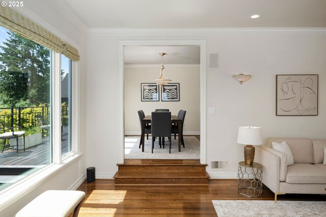 2892 NW Beuhla Vista Ter, Portland, OR 97210 - living room with dark wood-style floors, ornamental molding, baseboards, and recessed lighting