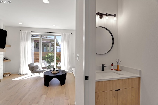 bathroom featuring hardwood / wood-style floors and vanity