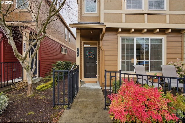 1639 SW 171st Ter, Beaverton, OR 97003 - view of exterior entry with stucco siding and fence