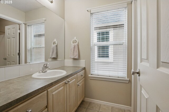 1639 SW 171st Ter, Beaverton, OR 97003 - bathroom with tile patterned flooring, plenty of natural light, vanity, and baseboards