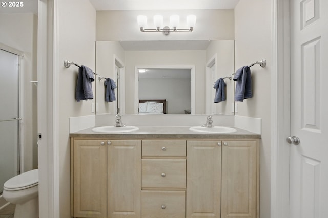 1639 SW 171st Ter, Beaverton, OR 97003 - full bath featuring double vanity, toilet, a shower with shower door, and a sink