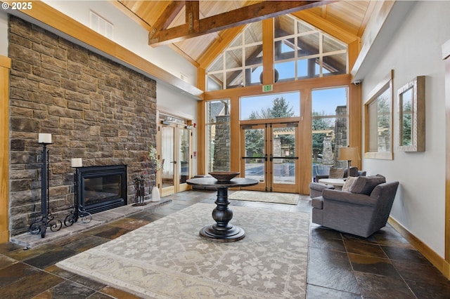 1639 SW 171st Ter, Beaverton, OR 97003 - living area featuring high vaulted ceiling, french doors, baseboards, and stone tile flooring