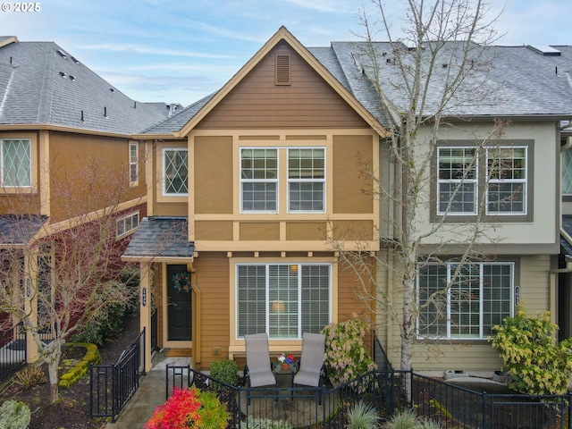 1639 SW 171st Ter, Beaverton, OR 97003 - multi unit property with a fenced front yard, a shingled roof, and stucco siding