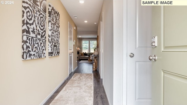 hallway featuring dark wood-type flooring