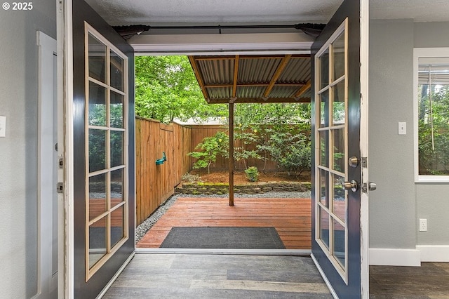 13616 SE Rhine St, Portland, OR 97236 - entryway featuring wood finished floors and baseboards