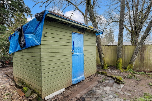 view of shed with fence