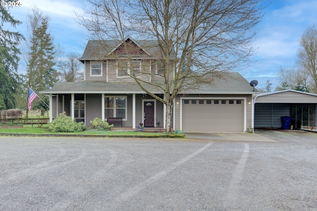 view of front of home with a carport, covered porch, and driveway