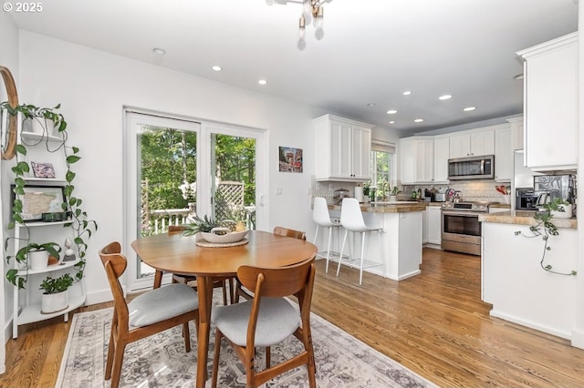 10272 NW Edgewood Dr, Portland, OR 97229 - dining room featuring light wood finished floors and recessed lighting