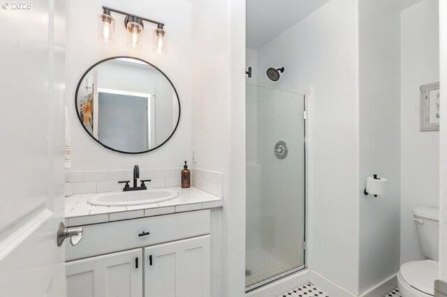 10272 NW Edgewood Dr, Portland, OR 97229 - bathroom with a shower stall, toilet, vanity, and backsplash