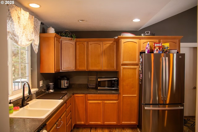 kitchen with sink and stainless steel refrigerator