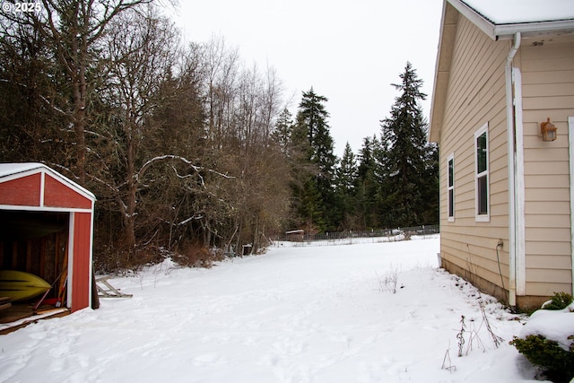 view of yard layered in snow