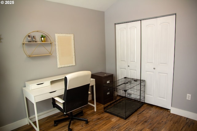 office area featuring dark hardwood / wood-style flooring and lofted ceiling