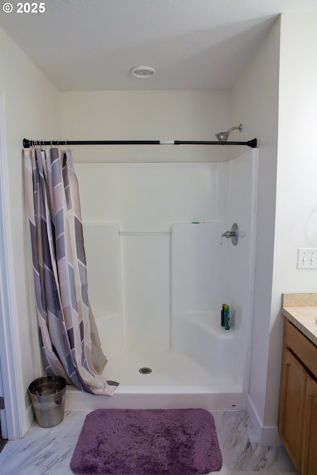 bathroom with vanity and a shower with shower curtain