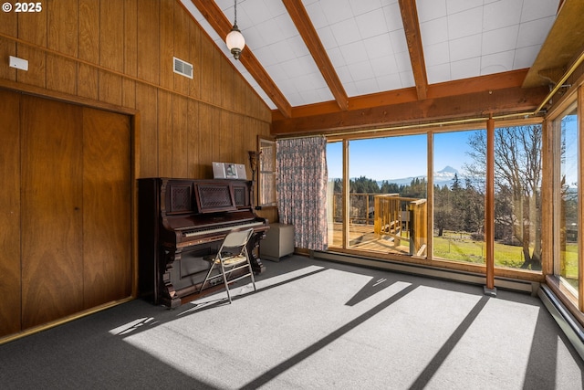 sunroom with visible vents, lofted ceiling with beams, and baseboard heating