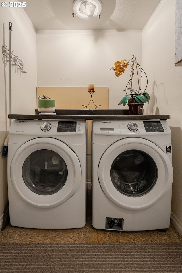 laundry area with laundry area and washer and clothes dryer