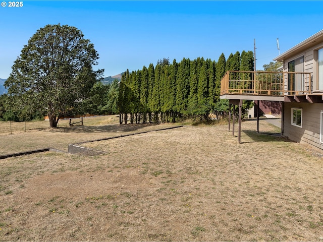 view of yard with a wooden deck