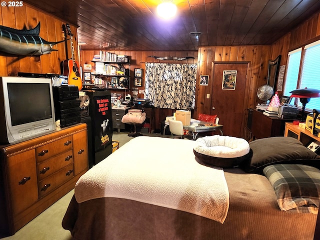 bedroom featuring wood walls, light carpet, and wooden ceiling