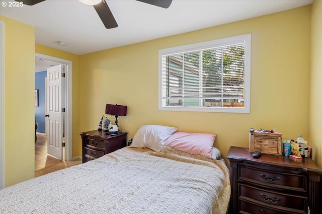 bedroom with a ceiling fan and carpet floors