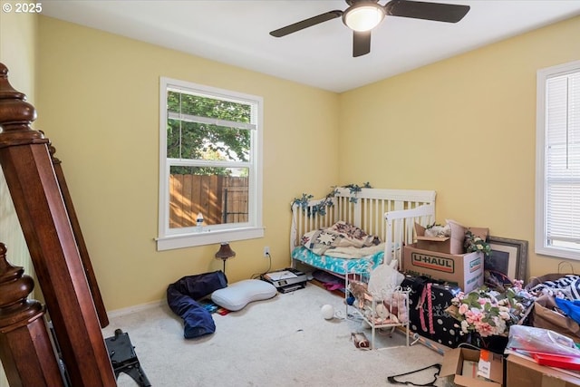 carpeted bedroom with ceiling fan