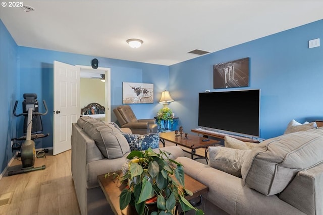 living area featuring wood finished floors and baseboards