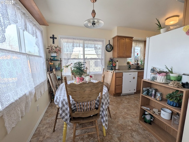 dining space with baseboards