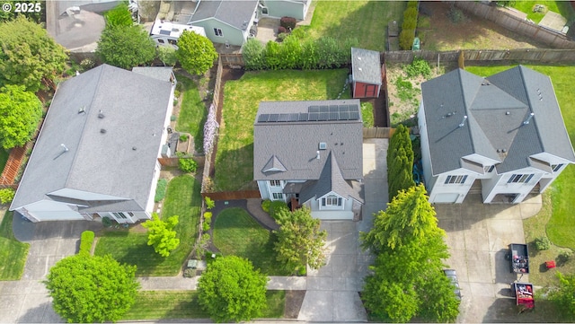 birds eye view of property with a residential view