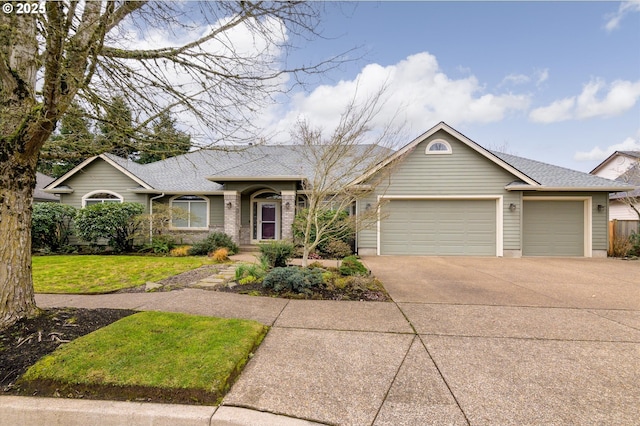 ranch-style home with a garage and a front lawn