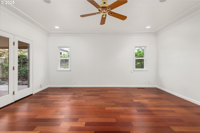 unfurnished room with dark hardwood / wood-style flooring, crown molding, and ceiling fan