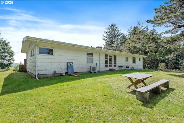 255 Coast Guard Hill Rd, Port Orford, OR 97465 - rear view of house featuring a lawn and ac unit