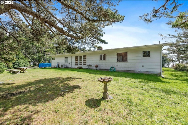 255 Coast Guard Hill Rd, Port Orford, OR 97465 - back of property featuring a lawn