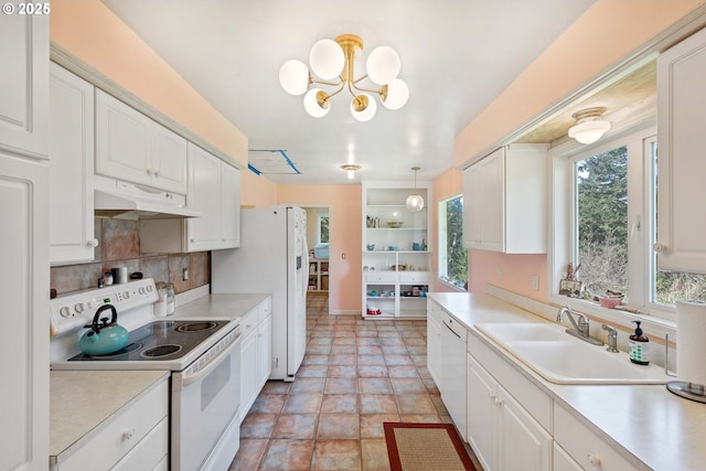 255 Coast Guard Hill Rd, Port Orford, OR 97465 - kitchen featuring white appliances, white cabinetry, under cabinet range hood, and a sink