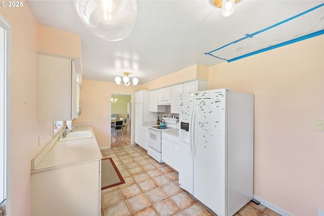 255 Coast Guard Hill Rd, Port Orford, OR 97465 - kitchen featuring white appliances, light countertops, a sink, and white cabinets