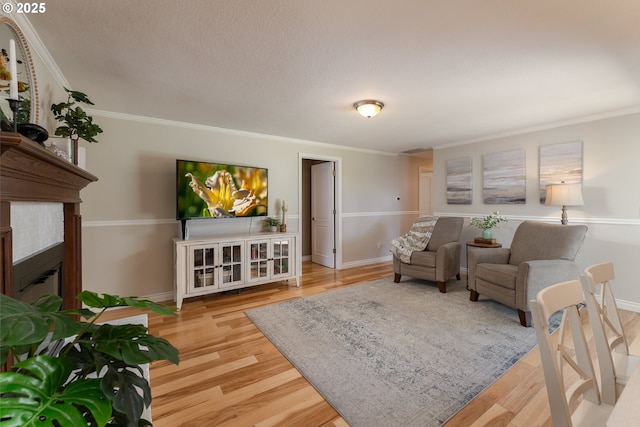 1025 S Grant St, Canby, OR 97013 - living room with wood finished floors, crown molding, and a fireplace