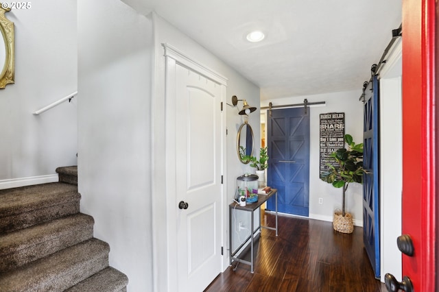 3490 Midway Ave NE, Salem, OR 97301 - foyer featuring a barn door, stairway, wood finished floors, and baseboards