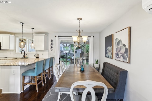 3490 Midway Ave NE, Salem, OR 97301 - dining room with dark wood-style floors, a chandelier, and a wall mounted air conditioner