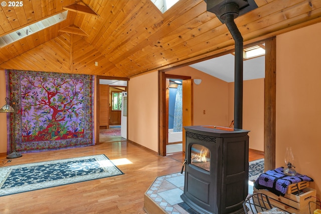 91625 W Fork Rd, Deadwood, OR 97430 - living room with a wood stove, vaulted ceiling, wood finished floors, and wood ceiling
