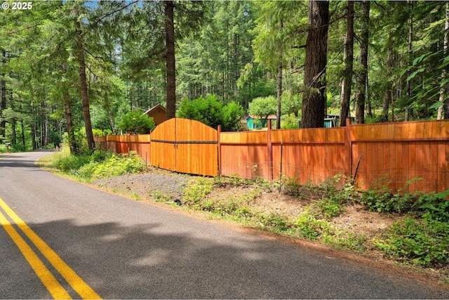 91625 W Fork Rd, Deadwood, OR 97430 - view of asphalt street with a wooded view and a gate